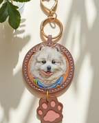 Custom-made luxury leather pet keepsakes and gifts featuring pet portraits, including cat and dog keychains.